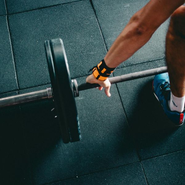 Man in a focused pose during a workout session.