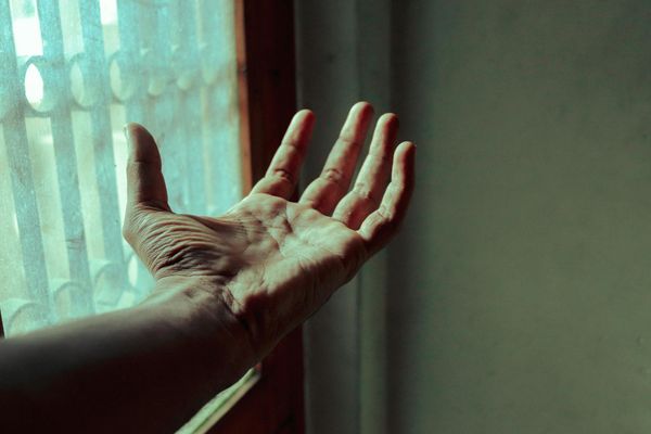 Silhouette of a person meditating with lines connecting head and body.